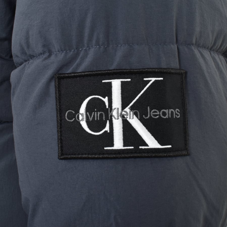Calvin klein jeans puffer jacket with logo patch online